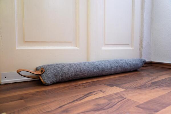 Rolled mat in a calm corner for gentle neck and shoulder work
